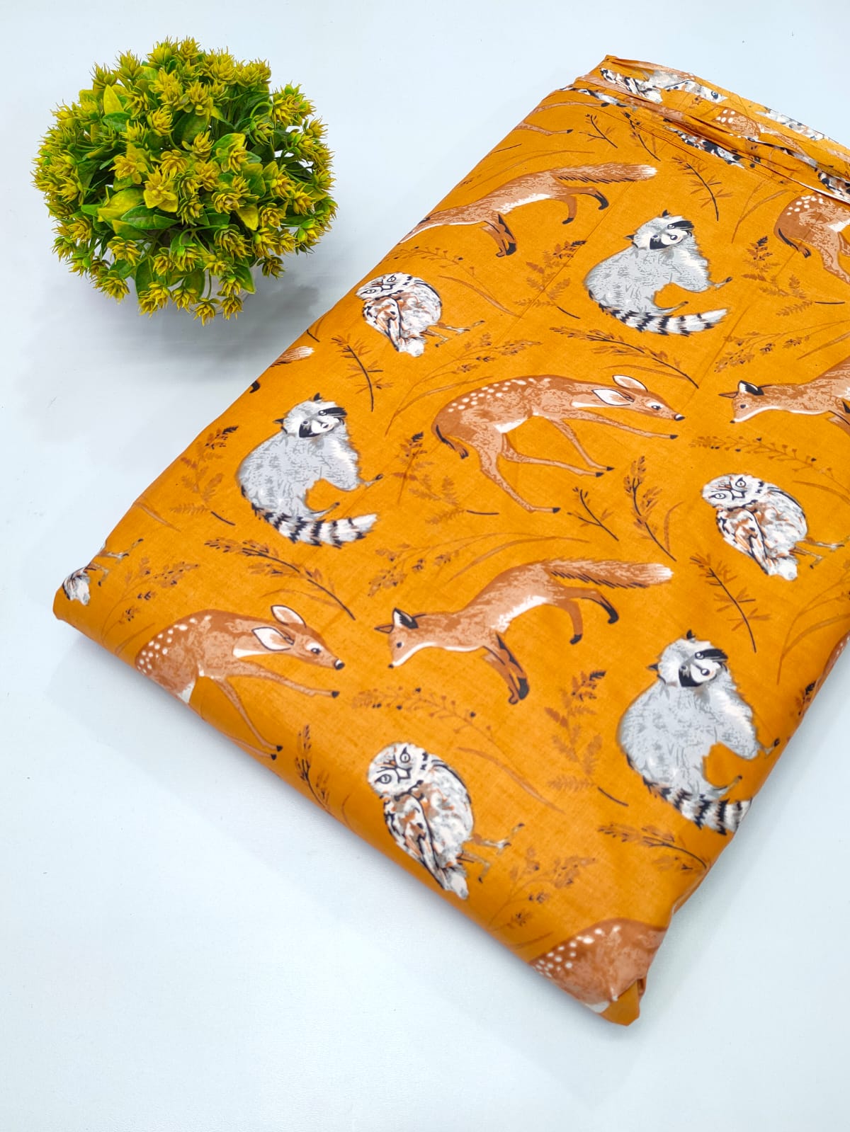 Close-up of Orange Animal Motif Screen Print Pure Cotton Fabric from Tulsi Prints