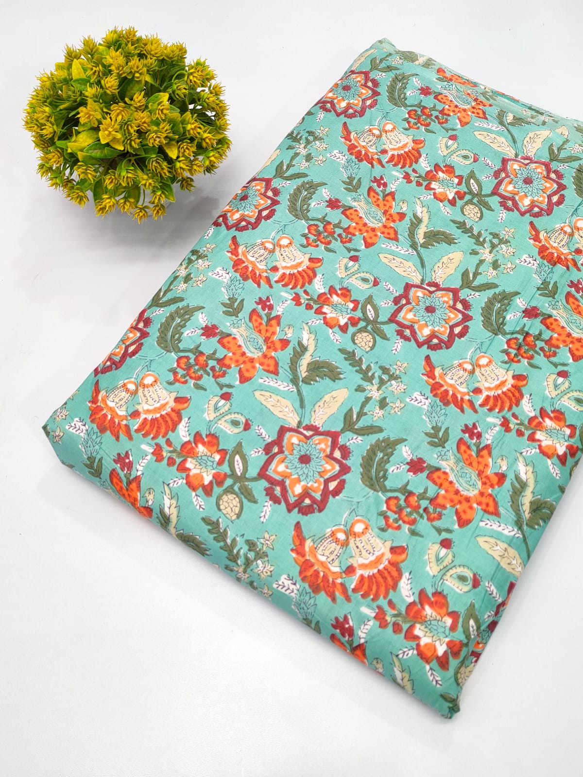 Close-up of Turquoise Floral Screen Print Pure Cotton Fabric from Tulsi Prints