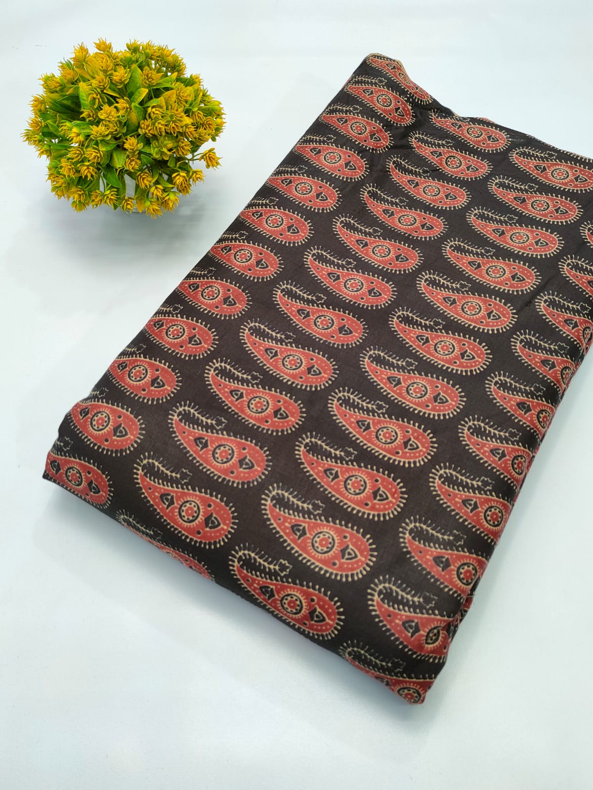 Close-up of Brown Paisley Screen Print Pure Cotton Fabric from Tulsi Prints