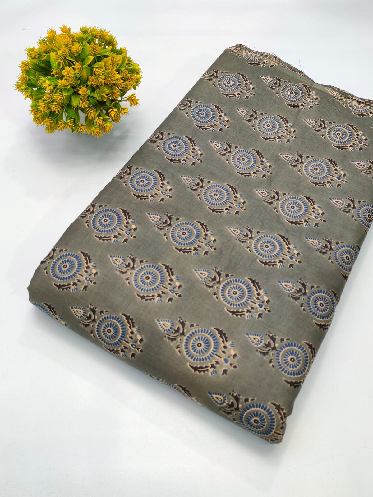 Close-up of Olive Green Paisley Print Screen Print Pure Cotton fabric from Tulsi Prints
