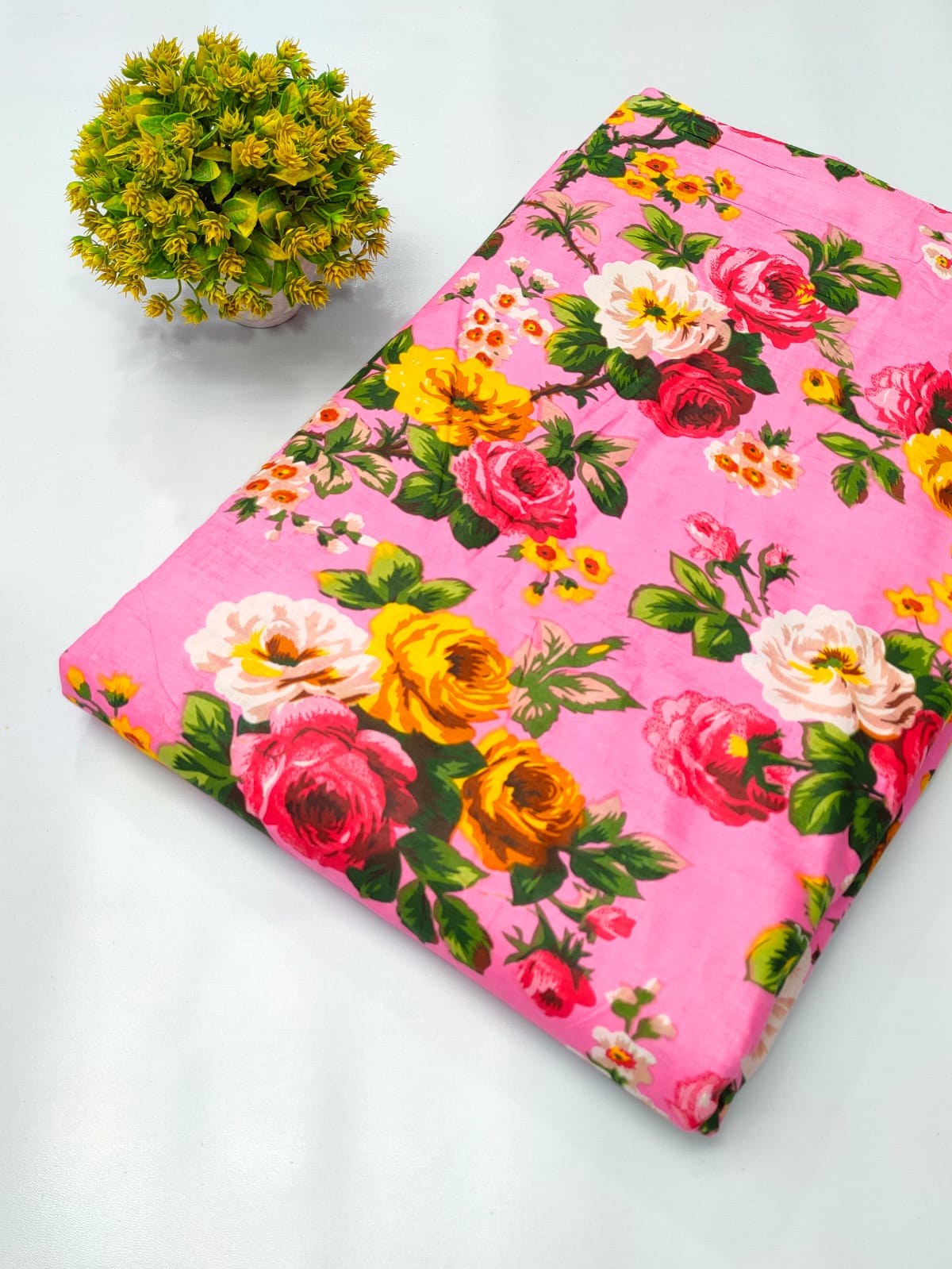 Close-up of pink floral screen print pure cotton fabric from Tulsi Prints