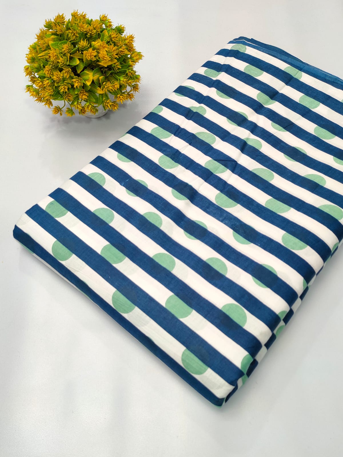 Close-up of Navy Blue Striped Polka Dot Screen Print Pure Cotton fabric from Tulsi Prints