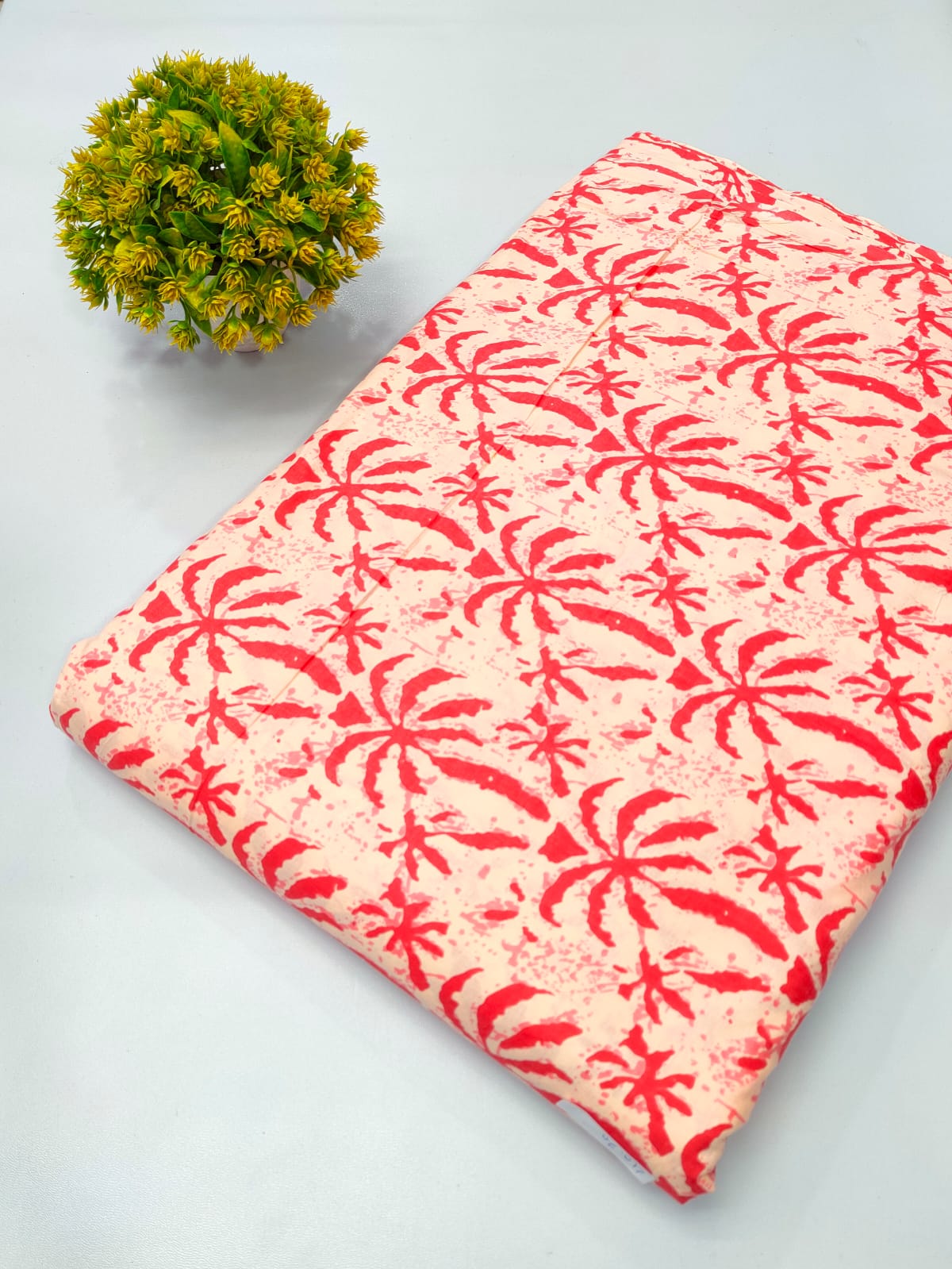 Close-up of Peach Palm Leaf Screen Print Pure Cotton Fabric from Tulsi Prints