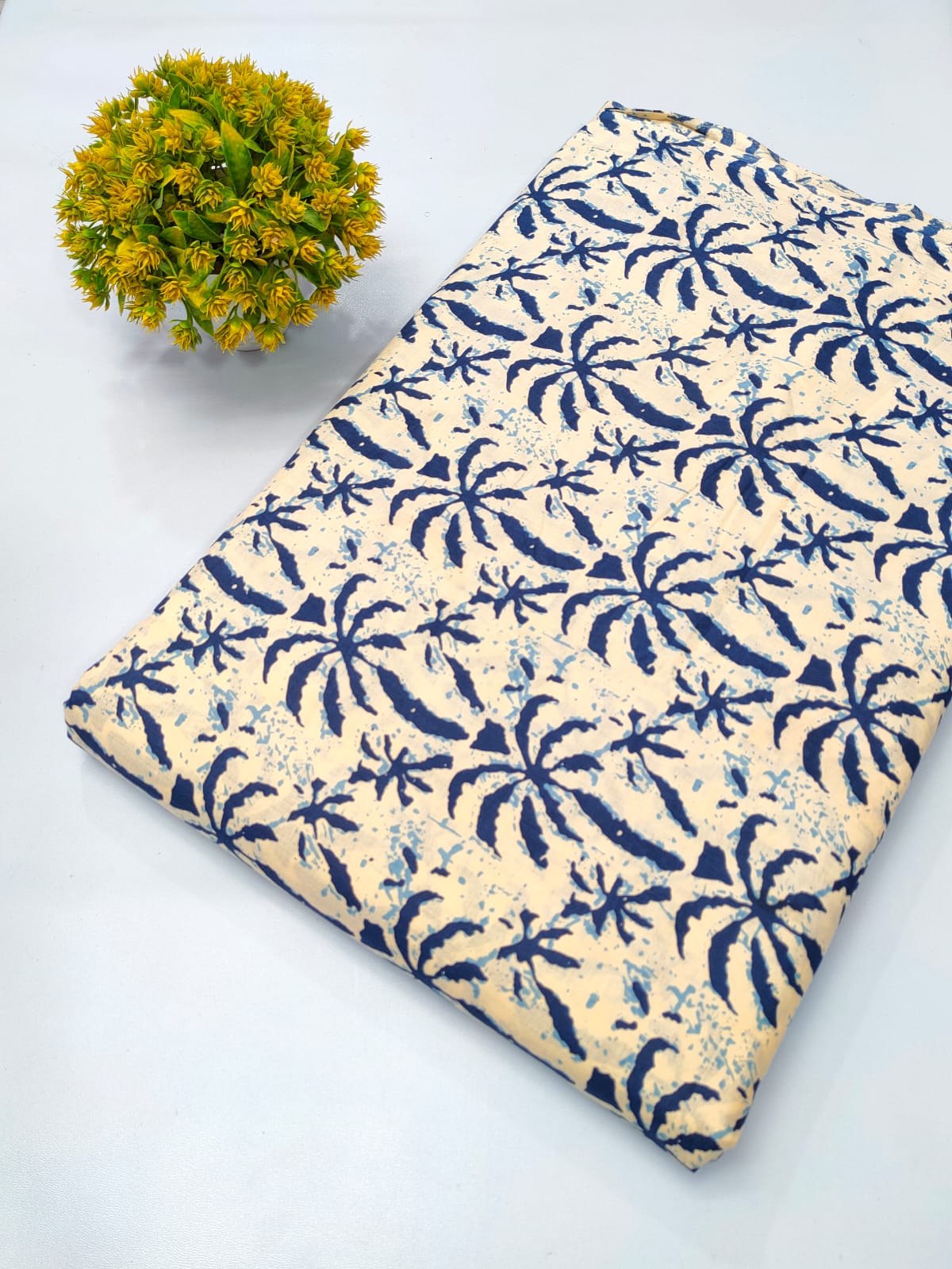 Close-up of Cream Tropical Leaf Screen Print Pure Cotton fabric from Tulsi Prints