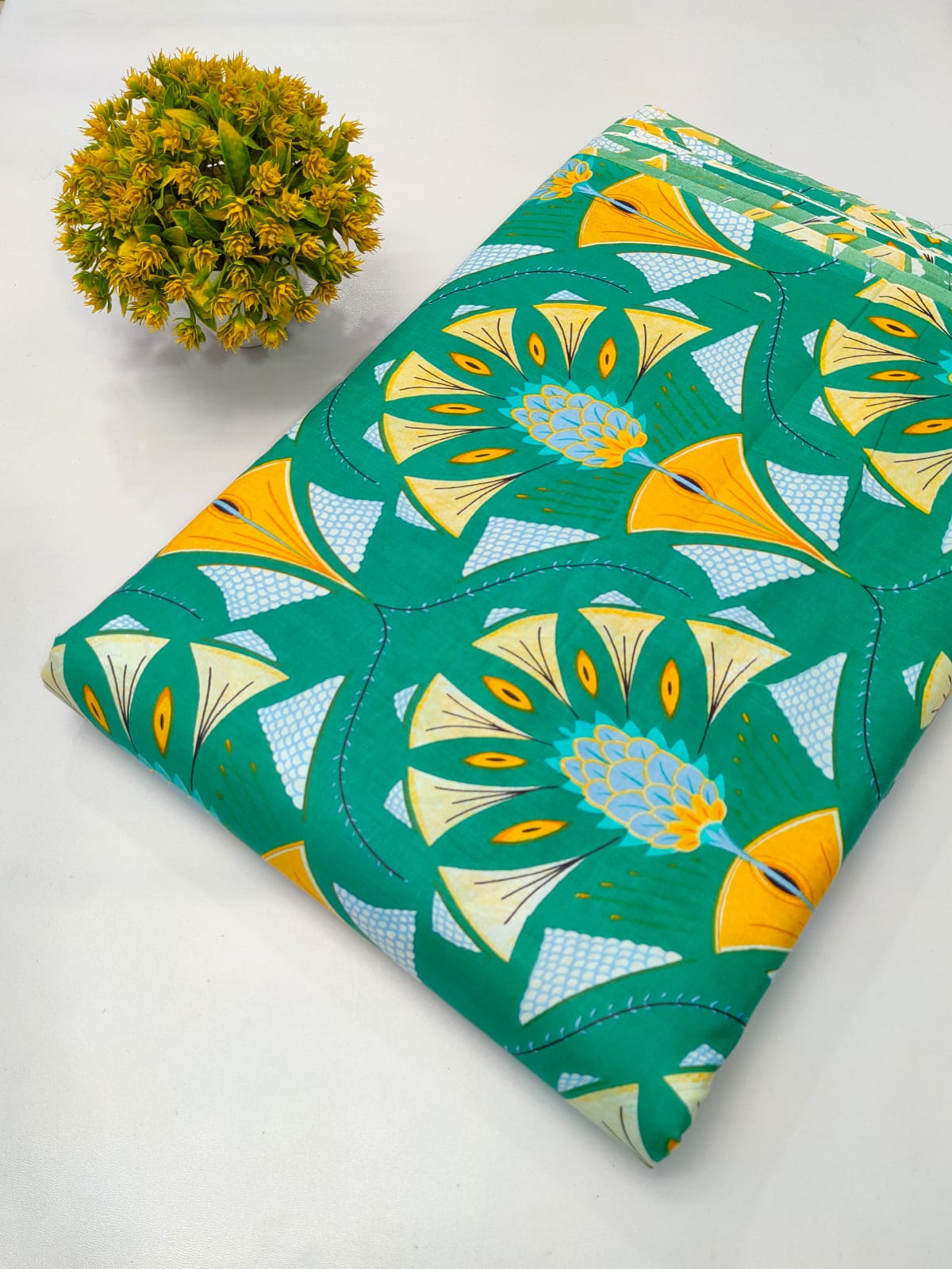 Close-up of green floral screen print pure cotton fabric from Tulsi Prints