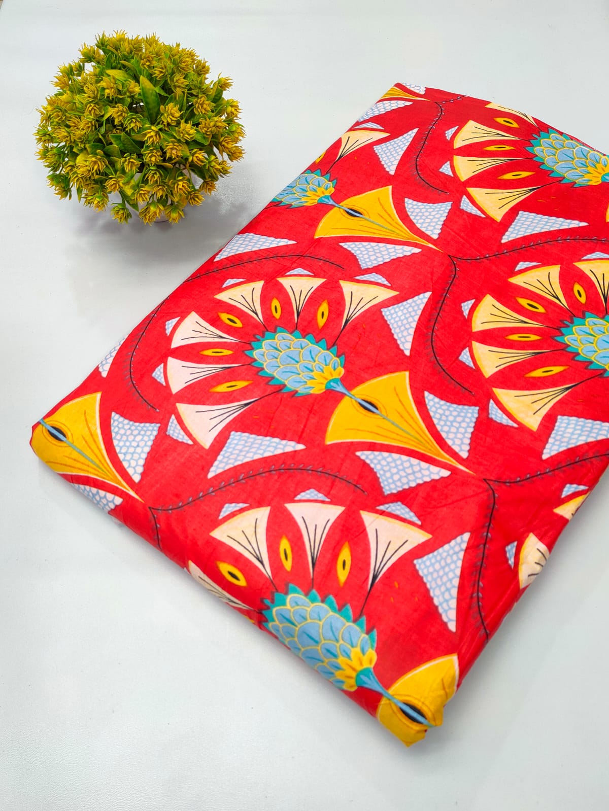 Close-up of red floral screen print pure cotton fabric from Tulsi Prints