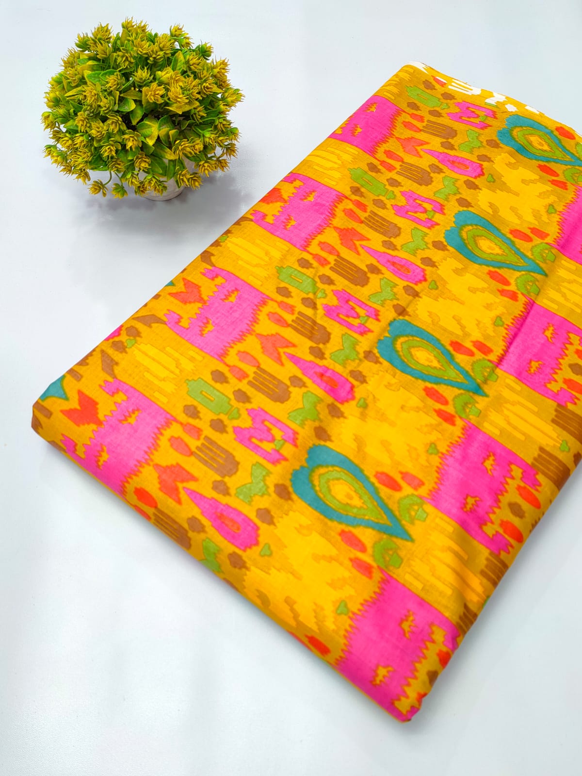Close-up of Yellow Paisley Screen Print Pure Cotton fabric from Tulsi Prints
