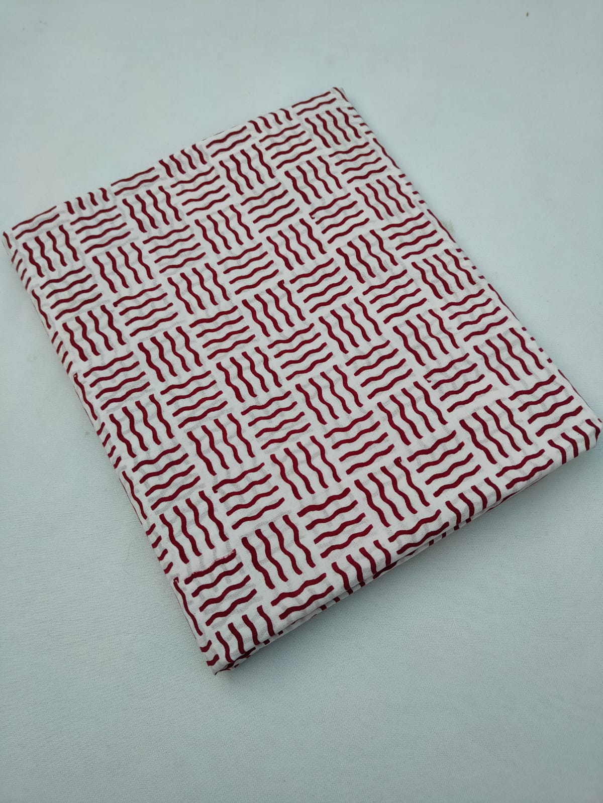 Off White And Maroon Wavy Geometric Block Print Pure Cotton Fabric From Tulsi Prints